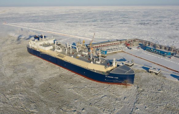 A gas carrier is loaded with liquefied natural gas at the berth in Russia