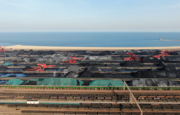 Drone picture showing a coal yard at a port in Rizhao city of Shandong province, northern China, on 2 February 2022. Credit: Oriental Image