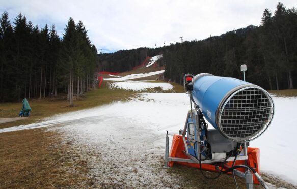 A snow gun stands on the periphery of the Kandahar ski slope in Garmisch-Partenkirchen, Germany.