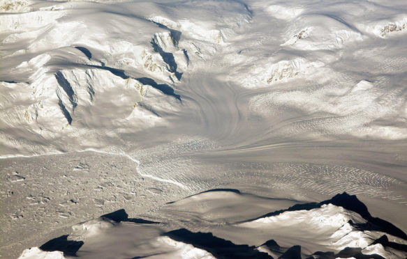 Glaciers-and-mountains-in-the-evening-sun-are-seen-on-an-Operation-IceBridge-research-flight,-returning-from-West-Antarctica-edited