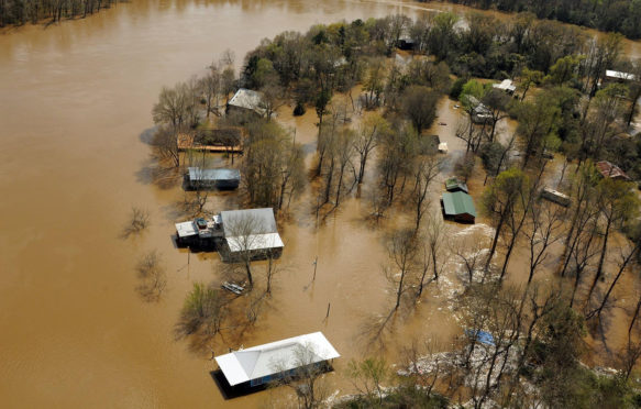 FNYKY6 Aerial view of homes submerged in floodwaters along the Pearl and Leaf Rivers after record breaking storms dumped rain across the deep south March 13, 2016 in St. Tammany Parish, Louisiana.