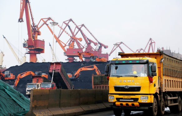 Several ships unload and transport coal at Lianyungang Port in Lianyungang.