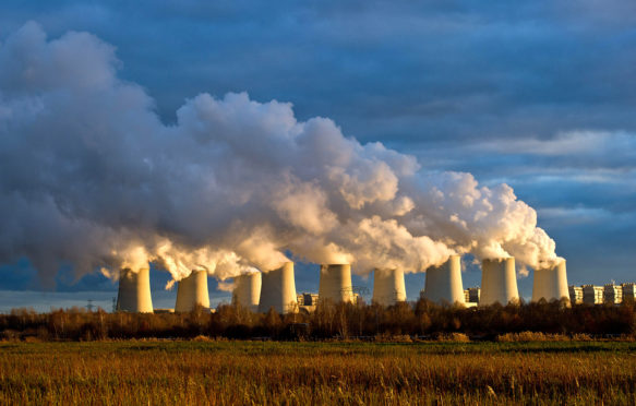 Cooling towers of a brown coal power station in Jänschwalde, Germany. Credit: dpa picture alliance archive / Alamy Stock Photo.